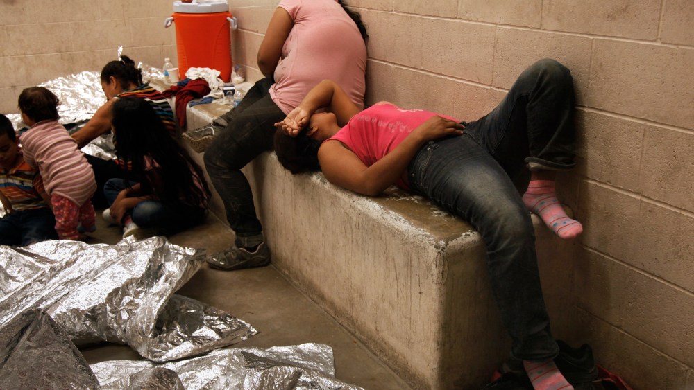 Immigrants who have been caught crossing the border illegally are housed inside the McAllen Border Patrol Station in McAllen, Texas on July 15, 2014, where they are processed. (Rick Loomis/Pool/Reuters)