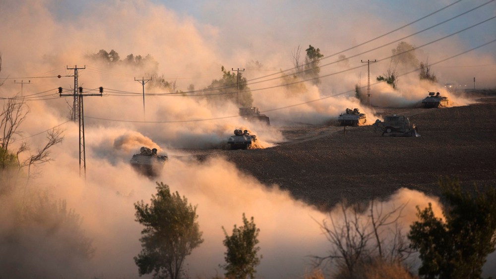 Israeli tanks manoeuvre outside the northern Gaza Strip