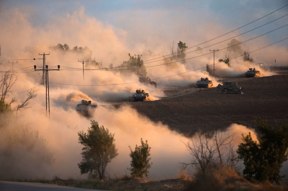 Israeli tanks manoeuvre outside the northern Gaza Strip