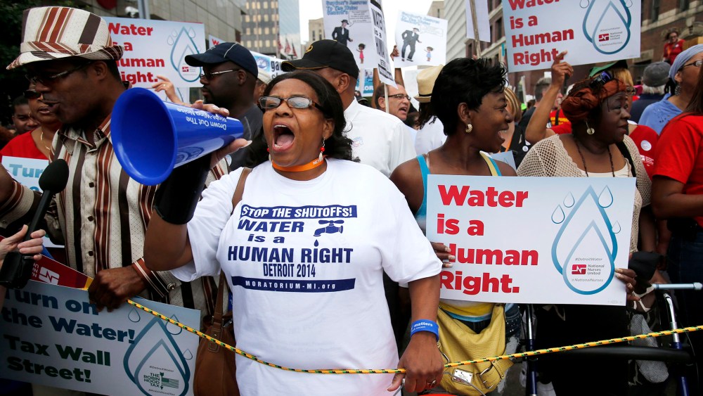 People gather to protest against the mass water shut-offs to Detroit citizens behind in their payments, July 18, 2014.