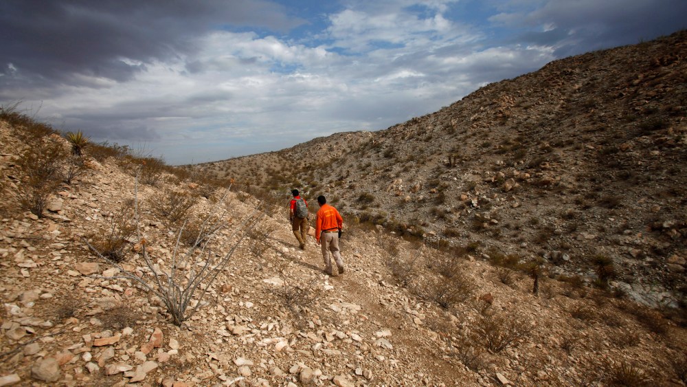 Members of Mexican immigrant welfare agency Grupo Beta search in the mountains between Mexico and the U.S. for potential border crossers during a patrol on the outskirts of Ciudad Juarez, July 29, 2014. (Photo by Jose Luis Gonzalez/Reuters)