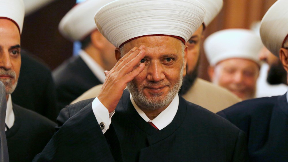 Newly appointed grand mufti Sheikh Abed el-Lateef Daryan gestures during a ceremony for his appointment in Beirut