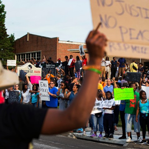 Demonstrators protest outside of Greater St. Marks Family Church in Ferguson, Missouri