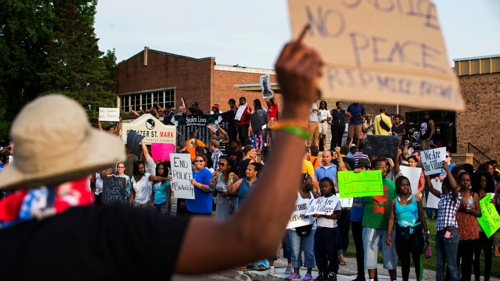 Demonstrators protest outside of Greater St. Marks Family Church in Ferguson, Missouri