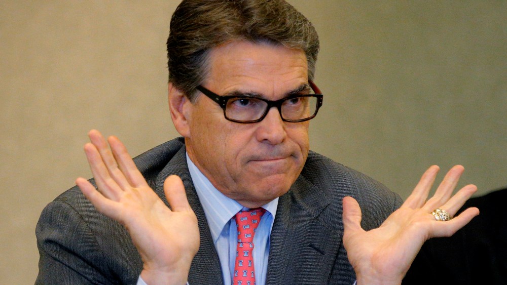 Texas Governor Perry answers question about indictment in Texas on two felony counts of abuse of power during appearance at business leaders luncheon in Portsmouth