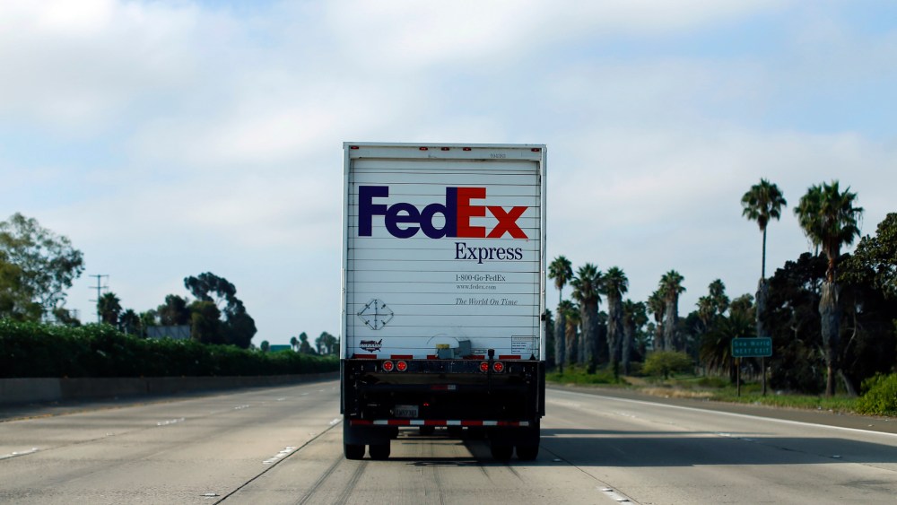 Federal Express truck makes its way down a freeway in San Diego, California