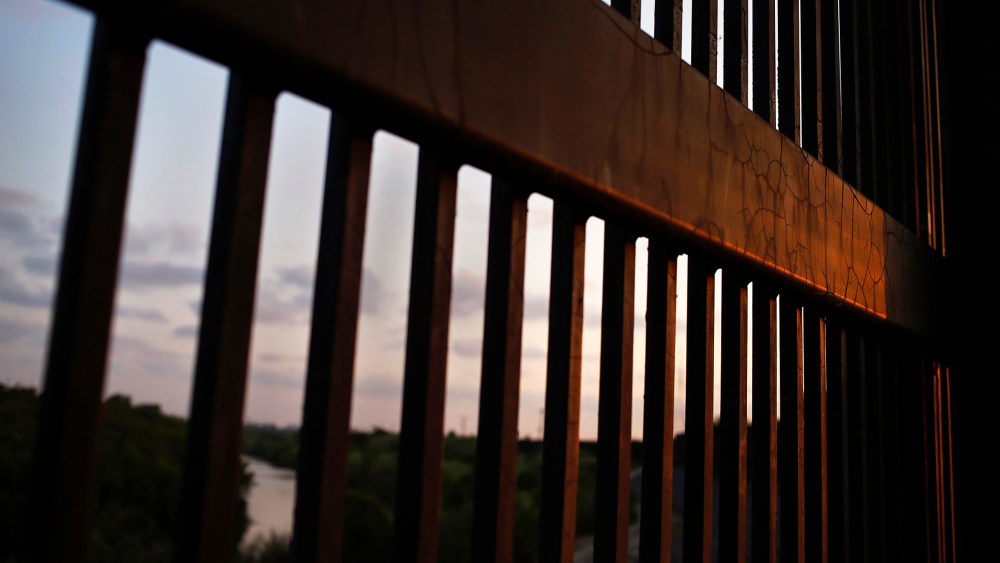The border fence stands at the United States-Mexico border along the Rio Grande river in Brownsville, Texas, on Aug. 5, 2014. (Photo by Shannon Stapleton/Reuters)