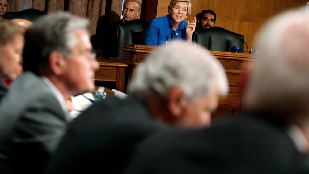 U.S. Senator Warren questions federal financial regulators about Wall Street reform before a Senate Banking Committee hearing on Capitol Hill in Washington