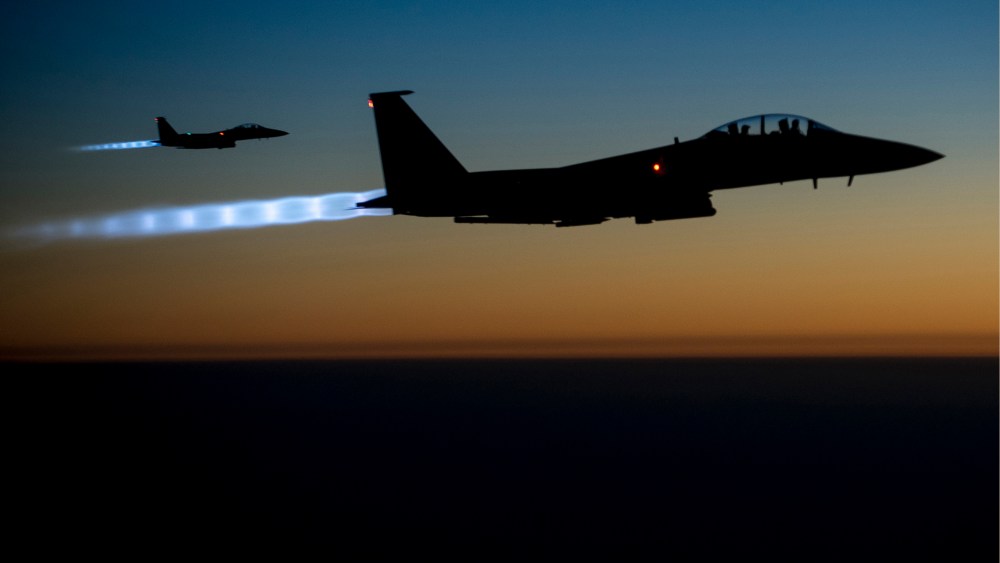 A pair of U.S. Air Force F-15E Strike Eagles fly over northern Iraq after conducting airstrikes in Syria, in this U.S. Air Force handout photo taken early in the morning of September 23, 2014. (Senior Airman Matthew Bruch/Handout/US Air Force/Reuters)