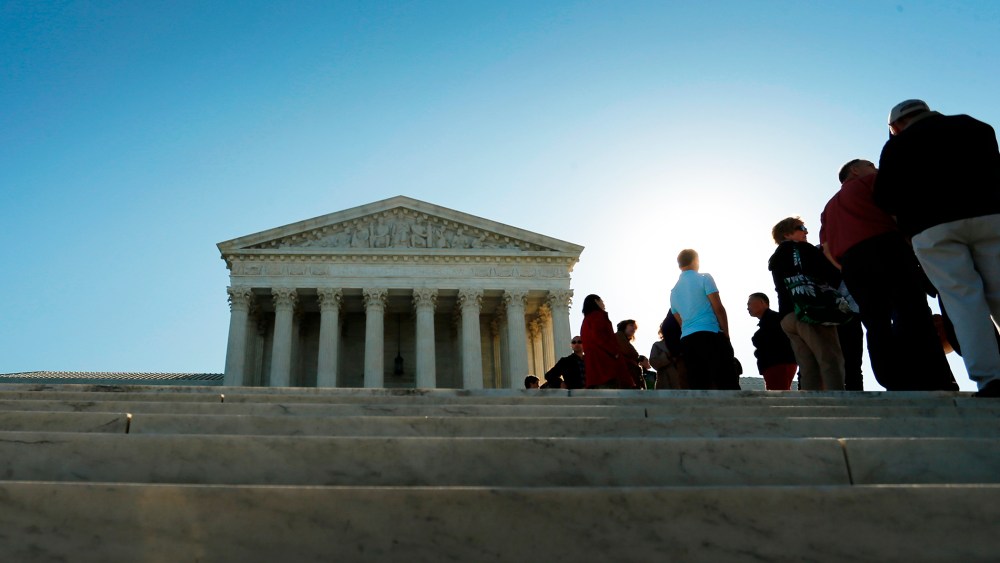 Visitors stand in line to watch arguments on the first day of the new term of the U.S. Supreme Court in Washington on Oct. 6, 2014. (Photo by Jonathan Ernst/Reuters)