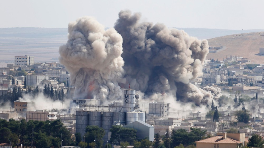 Smoke rises after an U.S.-led air strike in the Syrian town of Kobani on Oct. 8, 2014.