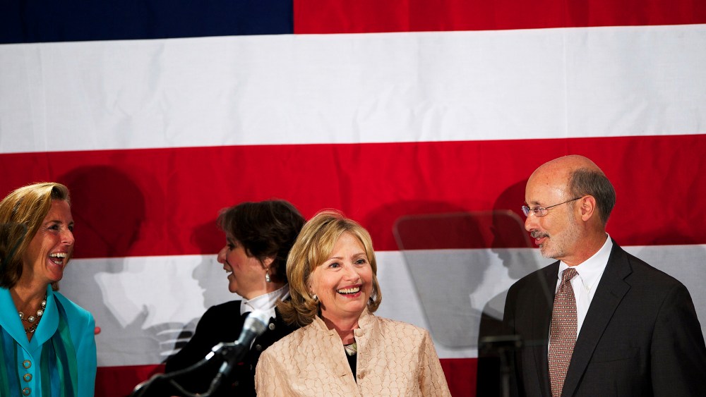 Hillary Clinton join Democratic challenger for Pennsylvania Governor Tom Wolf on stage at the National Constitution Center in Philadelphia, Penn. on Oct. 9, 2014.