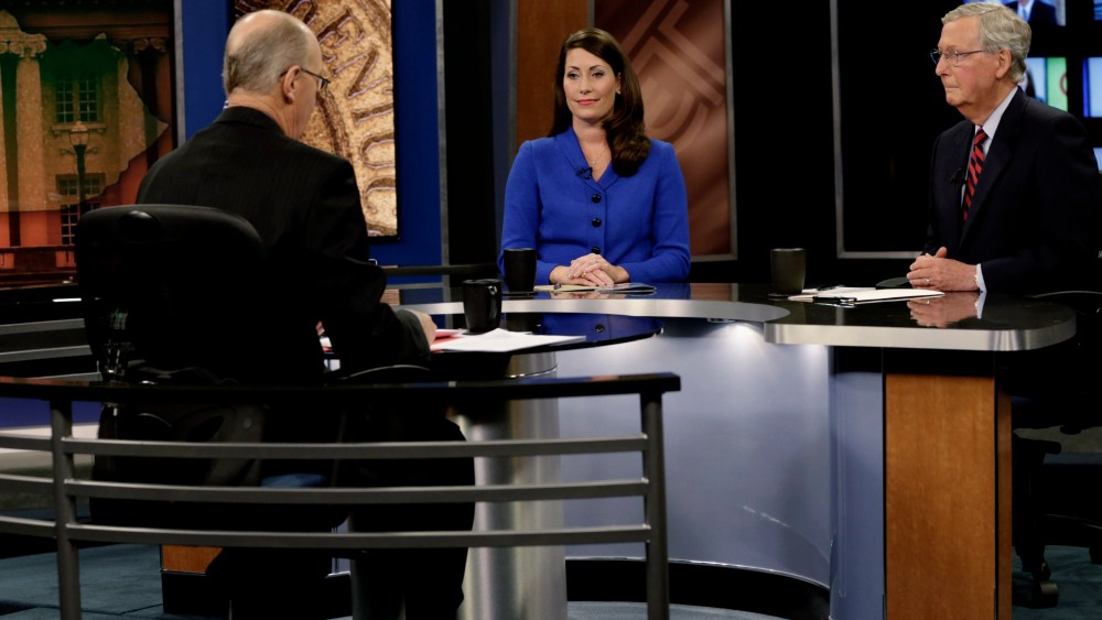 Republican U.S. Senate Minority Leader Mitch McConnell (R) and Democratic U.S. Senate candidate Alison Lundergan Grimes (L) prepare for their debate at the Kentucky Education Television network headquarters in Lexington, Ky on Oct. 13, 2014.