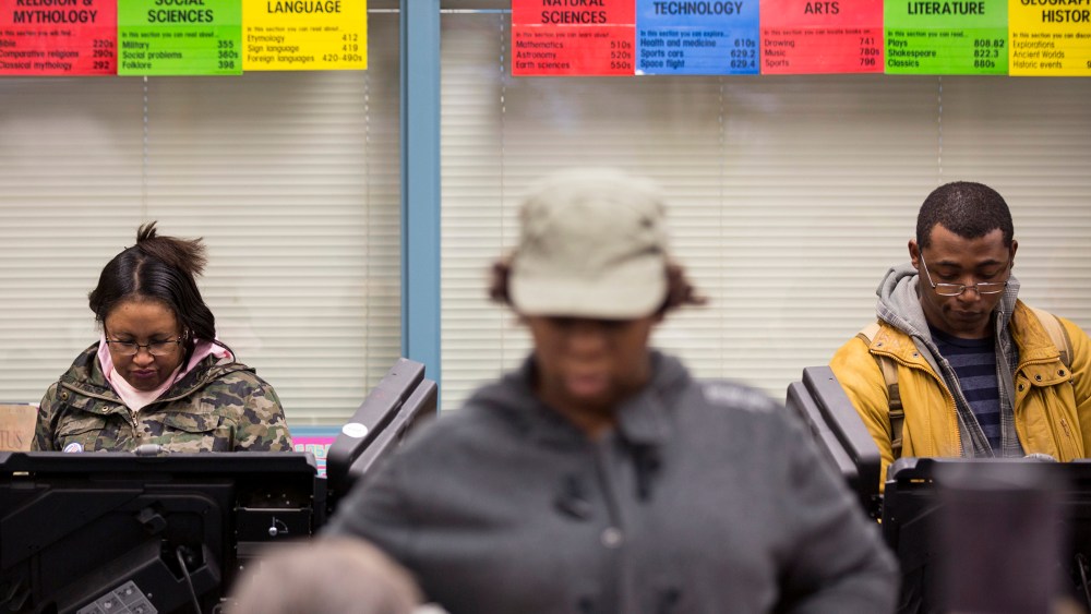 Voters cast their ballot in the U.S. midterm elections in Ferguson, Mo., Nov. 4, 2014. (Photo by Whitney Curtis/Reuters)