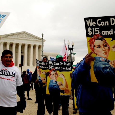 Low wage U.S. federal contract workers hold a strike rally, asking for a $15 per hour minimum wage, in front of the Capitol in Washington Nov. 13, 2014. (Photo by Gary Cameron/Reuters)