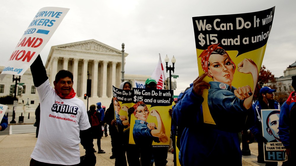 Low wage U.S. federal contract workers hold a strike rally, asking for a $15 per hour minimum wage, in front of the Capitol in Washington Nov. 13, 2014. (Photo by Gary Cameron/Reuters)