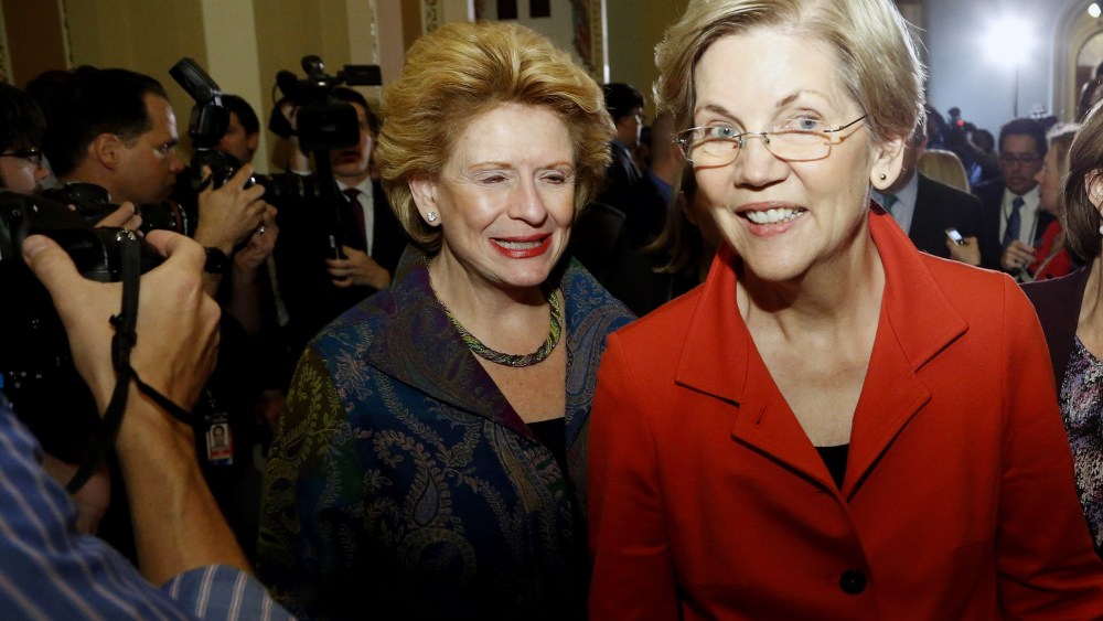 US Senator Elizabeth Warren, flanked by Senator Debbie Stabenow and Senator Amy Klobuchar leaves after speaking to reporters following a leadership election for the 114th Congress in Washington, Nov. 13, 2014. (Photo by Jonathan Ernst/Reuters)