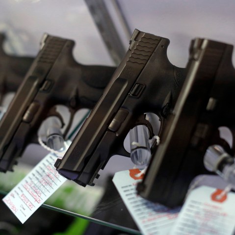 Handguns are seen for sale in a display case. (Photo by Jim Young/Reuters)