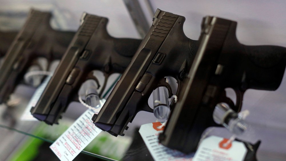 Handguns are seen for sale in a display case. (Photo by Jim Young/Reuters)
