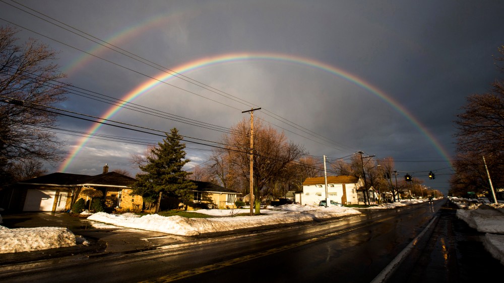 A rainbow forms over a neighbourhood following a massive snow storm in West Seneca