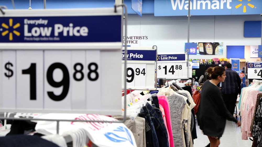 A woman shops at Walmart as the store prepares for Black Friday in Los Angeles, Calif. Nov. 24, 2014. (Photo by Jonathan Alcorn/Reuters)