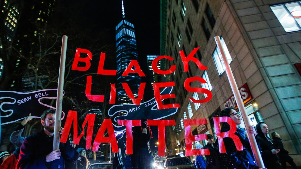 Protesters march next to One World Trade Center in Lower Manhattan in New York City as thousands of demonstrators take to the streets demanding justice for the death of Eric Garner, on Dec. 4, 2014. (Photo by Eduardo Munoz/Reuters)