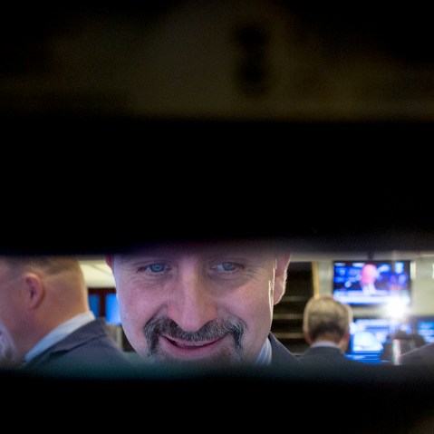 Traders work on floor of New York Stock Exchange