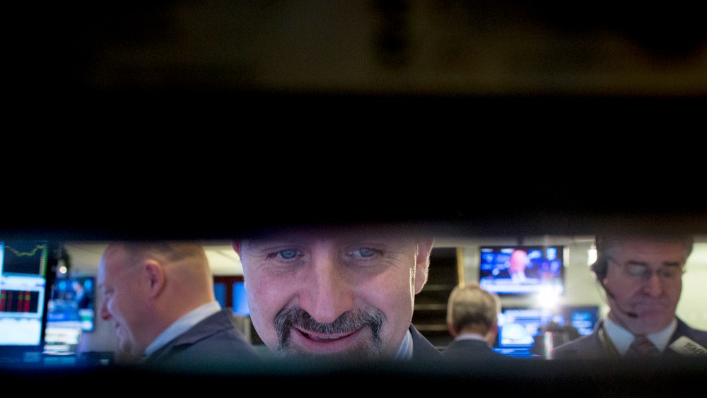 Traders work on floor of New York Stock Exchange
