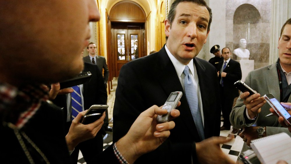 U.S. Senator Ted Cruz (R-TX) talks to reporters after the Senate passed a $1.1 trillion spending bill following a long series of votes at the U.S. Capitol in Washington on Dec. 13, 2014.