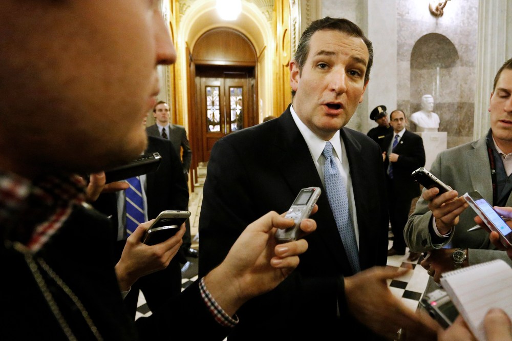 U.S. Senator Ted Cruz (R-TX) talks to reporters after the Senate passed a $1.1 trillion spending bill following a long series of votes at the U.S. Capitol in Washington on Dec. 13, 2014.