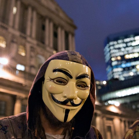 Supporters of the activist group Anonymous are seen at a protest in London on Dec. 23, 2014. (Photo by Neil Hall/Reuters)