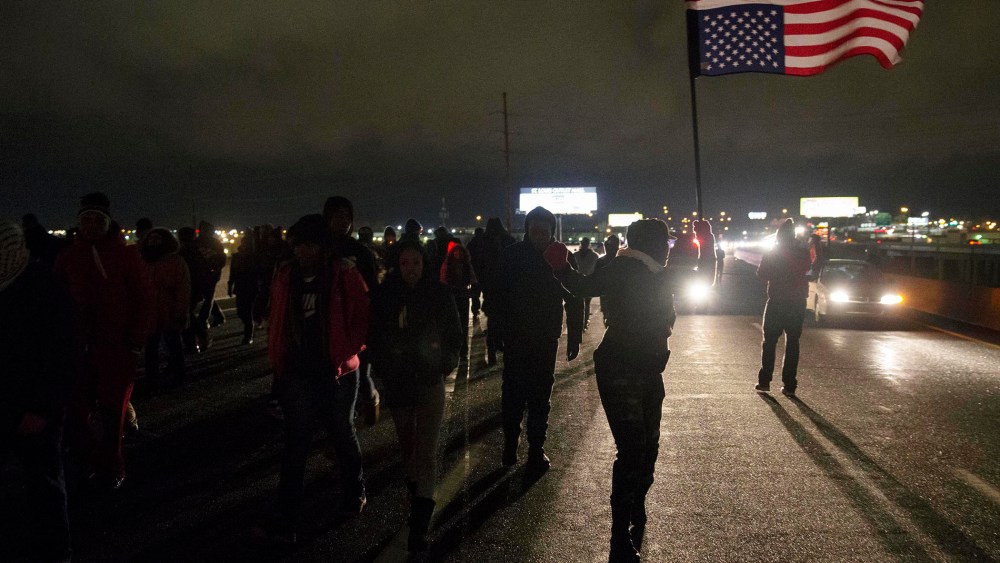 Protesters block Highway 170, after a man was fatally shot by a police man in Berkeley, Mo on Dec. 24, 2014.
