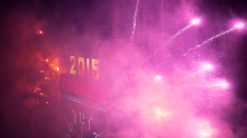 The New Year's Eve Ball Drop is lit with fireworks after the clock strikes midnight during New Year's Eve celebrations in Times Square, New York