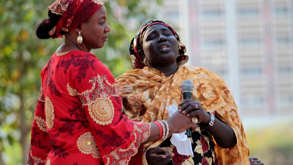 Rebecca Samuel (R), mother of one of the abducted Chibok schoolgirls, reacts while speaking at a meeting to review efforts to recover the abducted Chibok girls in Abuja, Nigeria, on Jan. 1, 2015. (REUTERS/Afolabi Sotunde)