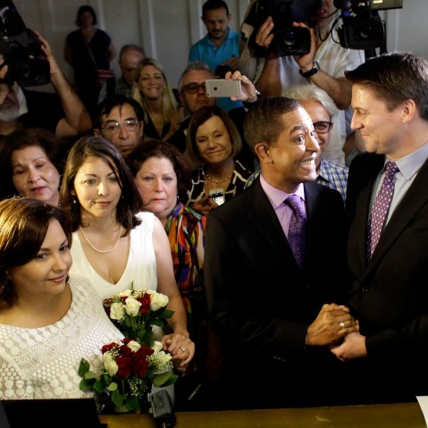 Same-sex couples Todd (2nd R), and Jeff Delmay with Catherina Pareto and Karla Arguello (L) get married at the Eleventh Judicial Circuit Court of Florida in Miami, Florida, Jan. 5, 2015. (Photo by Javier Galeano/Reuters)