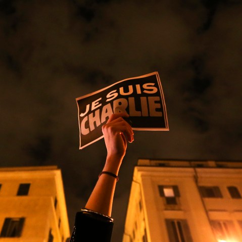 A woman holds a placard reading "I am Charlie," to pay tribute to victims following a shooting at the offices of weekly newspaper Charlie Hebdo in Paris, in front of the French embassy in Rome, Jan. 8, 2015. (Photo by Alessandro Bianchi/Reuters)