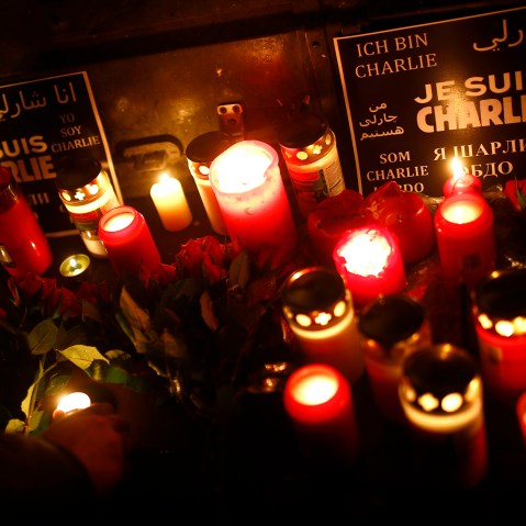 People light candles to pay tribute to victims during a vigil in Frankfurt on Jan. 8, 2015, following a shooting by gunmen at the offices of weekly satirical magazine Charlie Hebdo in Paris. (Photo Kai Pfaffenbach/Reuters)