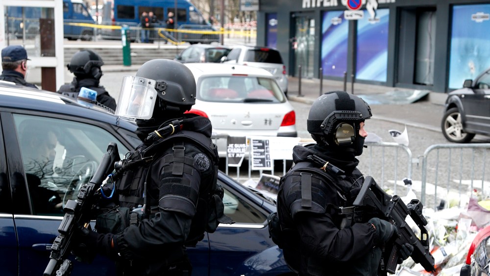 French RAID forces secure the area of the Hyper Cacher kosher supermarket, where four hostages were killed in a terror attack on Jan. 9, for a visit by Israel's Prime Minister Benjamin Netanyahu on Jan. 12, 2015. (Photo by Charles Platiau/Reuters)