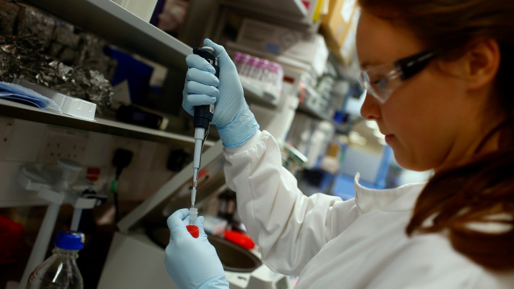 Research assistant Georgina Bowyer works on a vaccine for Ebola at The Jenner Institute in Oxford, southern England, Jan. 16, 2015. (Photo by Eddie Keogh/Reuters)