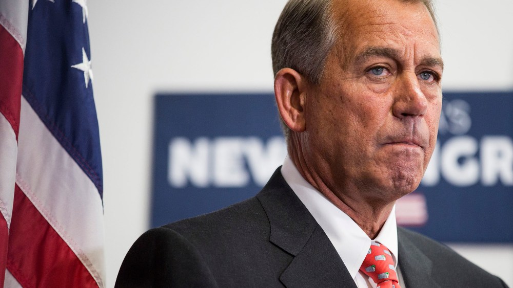 Speaker of the House Boehner listens as his fellow Republicans speak to the media after a conference meeting with House Republicans