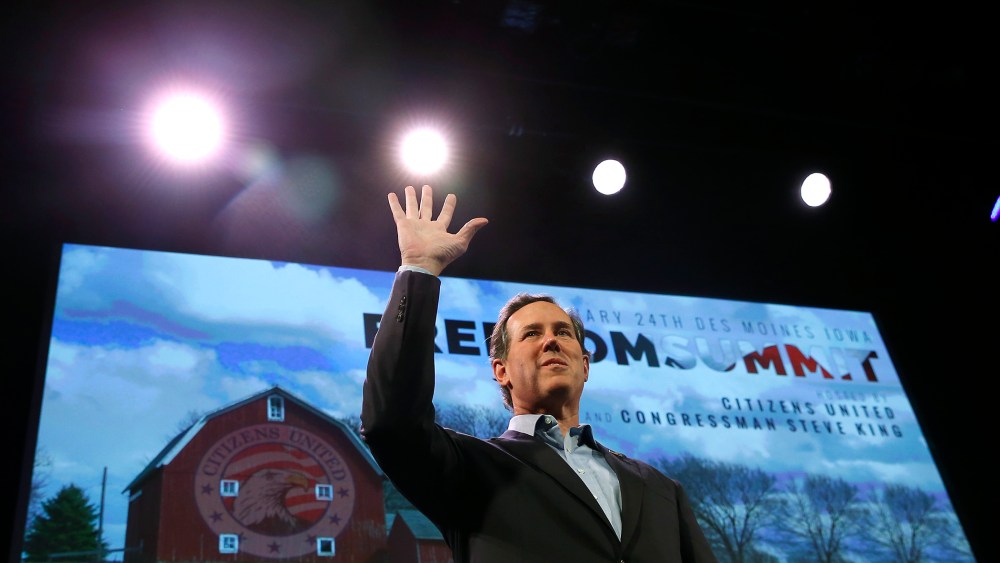 Former U.S. Senator Rick Santorum (R-PA) waves after speaking at the Freedom Summit in Des Moines, Iowa, January 24, 2015. (Photo by Jim Young/Reuters)