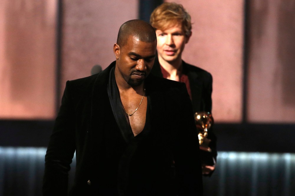 Beck watches Kanye West, who pretended to take the stage after Beck won album of the year for "Morning Phase," at the 57th annual Grammy Awards in Los Angeles, Calif., on Feb. 8, 2015. (Photo by Lucy Nicholson/Reuters)