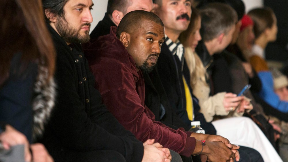 Singer Kanye West sits in the front row at the Jeremy Scott Fall/Winter 2015 collection show at New York Fashion Week on Feb. 18, 2015. (Photo by Andrew Kelly/Reuters)