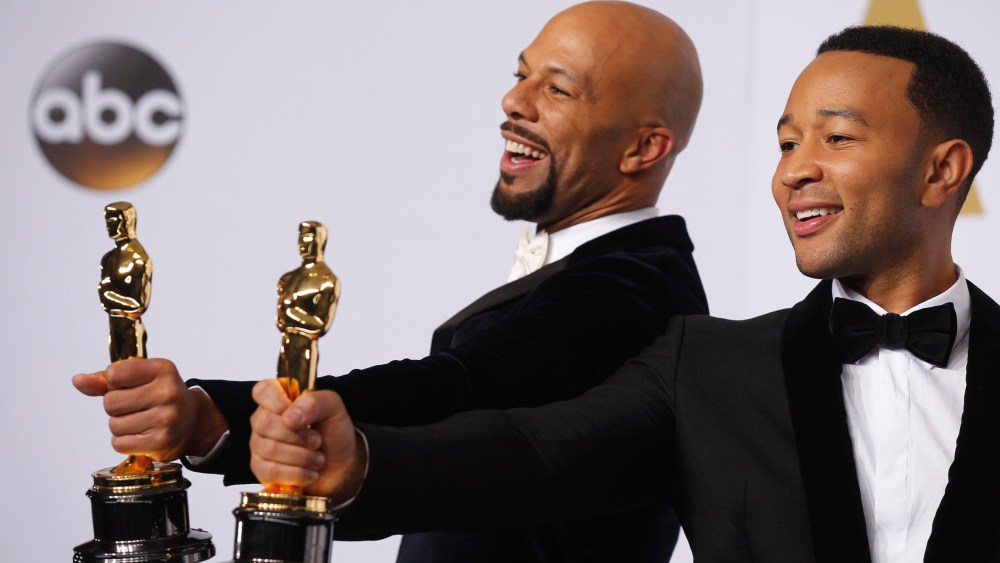 Singers Common and John Legend take the stage to pose with their Oscars after winning the award for best original song for "Glory" from the film "Selma" during the 87th Academy Awards in Hollywood, Calif., Feb. 22, 2015. (Photo by Lucy Nicholson/Reuters)