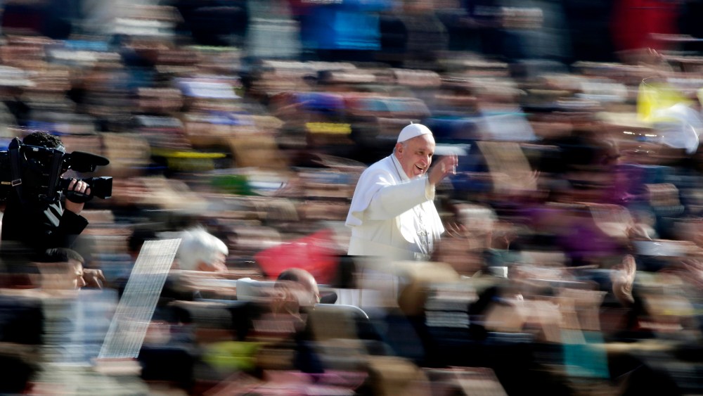 Pope Francis waves as he arrives during the general audience in St. Peter's Square at the Vatican March 4, 2015. (Photo by Max Rossi/Reuters)