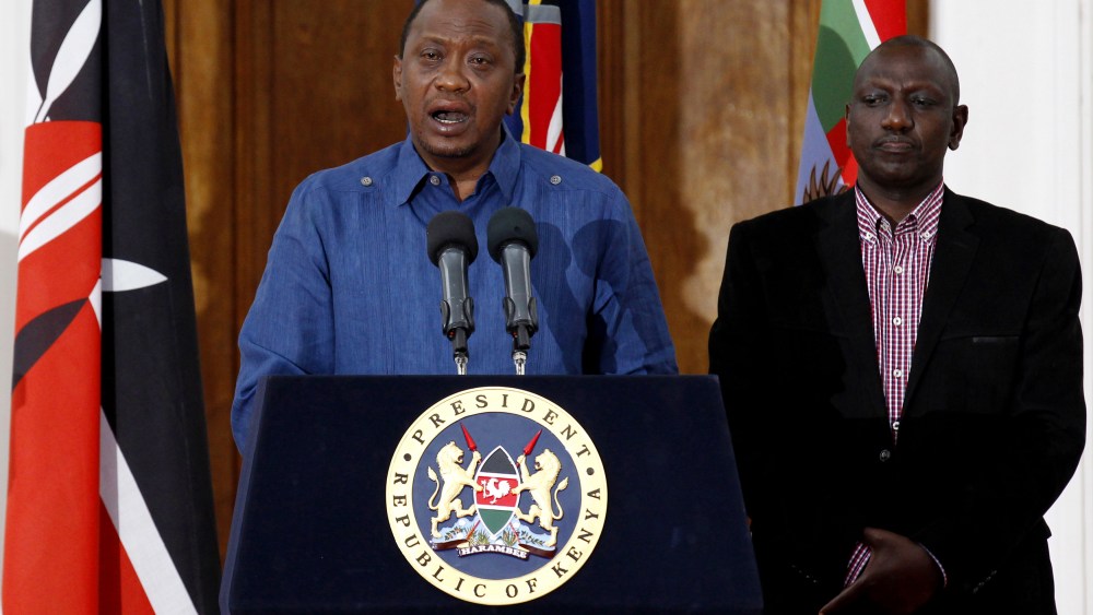Kenyan President Uhuru Kenyatta (L), flanked by his Deputy William Ruto, addresses a news conference at the State House in the capital Nairobi April 4, 2015. (Photo by Thomas Mukoya/Reuters)