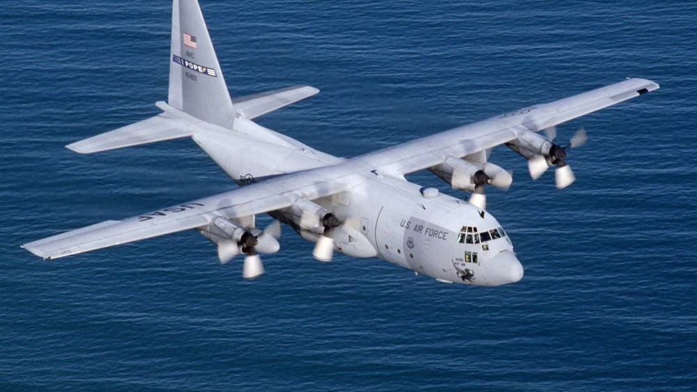 The U.S. Air Force on Dec. 14, 2004 said it has begun flying C-130s to transport cargo above the most dangerous routes in Iraq to ease pressure on truck convoys increasingly targeted by insurgents. (Photo by Sgt. Howard Blair/Reuters)