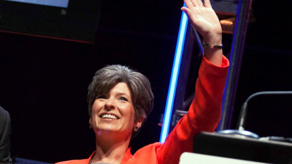 Joni Ernst waves after speaking at the Family Leadership Summit in Ames, Iowa August 9, 2014.