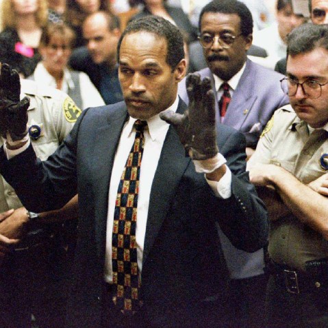 O.J. Simpson holds up his hands to the jury in this June 15, 1995 file photo. (Photo by Sam Mircovich/Reuters)