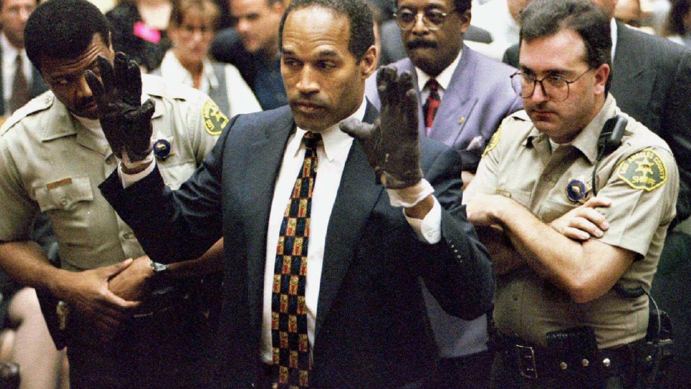 O.J. Simpson holds up his hands to the jury in this June 15, 1995 file photo. (Photo by Sam Mircovich/Reuters)